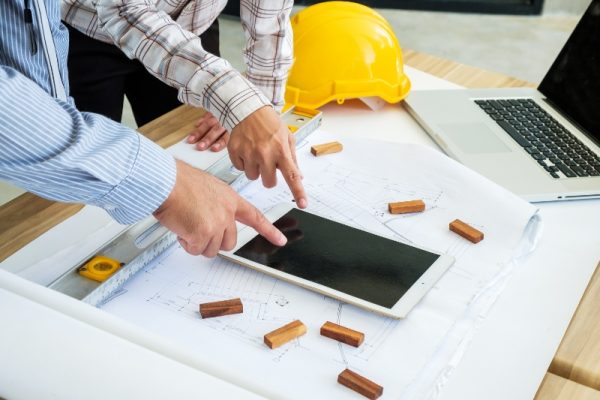 low-angle-view-man-using-laptop-table
